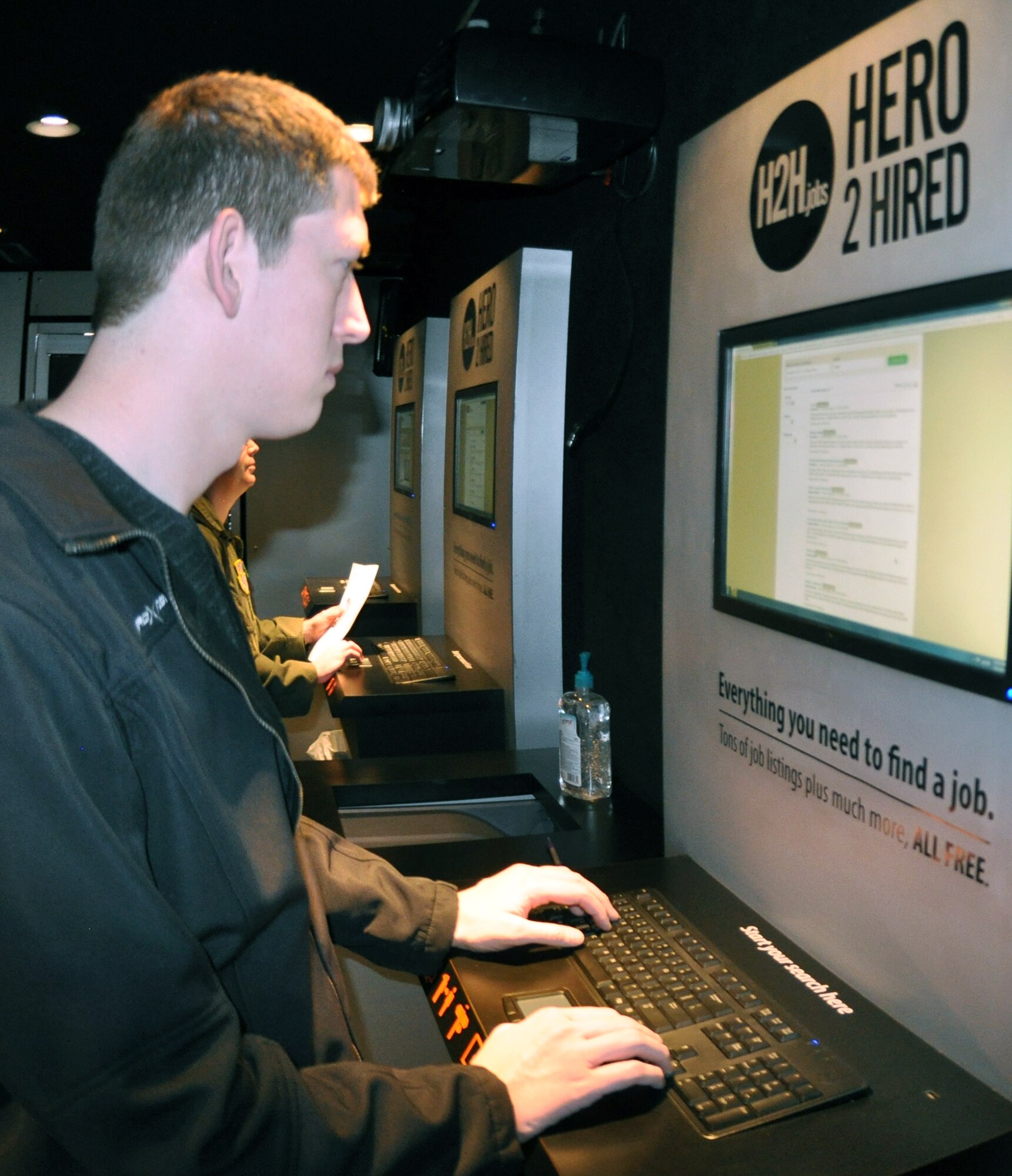 PETERSON AIR FORCE BASE, Colo. -- Senior Airman Cooper McCollum searches for jobs and updates his resume in the Hero to Hired mobile job store Jan. 22 here. The one-stop mobile job store was at Peterson for two days and assisted dozens of Guard and Reserve members, and their dependents, with multiple aspects of their job searches. The van, an Office of the Assistant Secretary of Defense for Reserve Affairs program, spends about 200 days on the road, traveling to bases around the country. The Hero to Hired website: https://h2h.jobs/  is always available and users can request job counseling assistance through the website. McCollum, an Air Force Reservist, is a water and fuel system apprentice with the 302nd Civil Engineer Squadron. (U.S. Air Force photo/Tech. Sgt. Daniel Butterfield) 