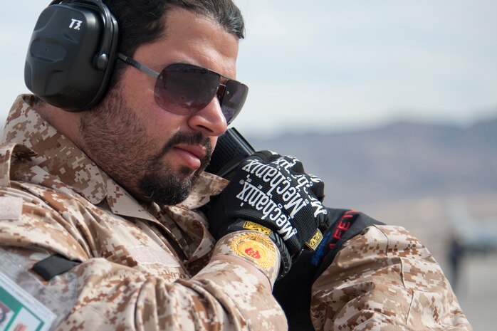A United Arab Emirates Air Force crew chief communicates with his maintenance operations center on the status of a Mirage 2000-9 prior to a Red Flag 13-2 mission on the Nellis Air Force Base flight line Jan. 23, 2013. The Red Flag exercise provides allied air forces personnel an opportunity to train in a joint combat environment. (U.S. Air Force photo by Lawrence Crespo)