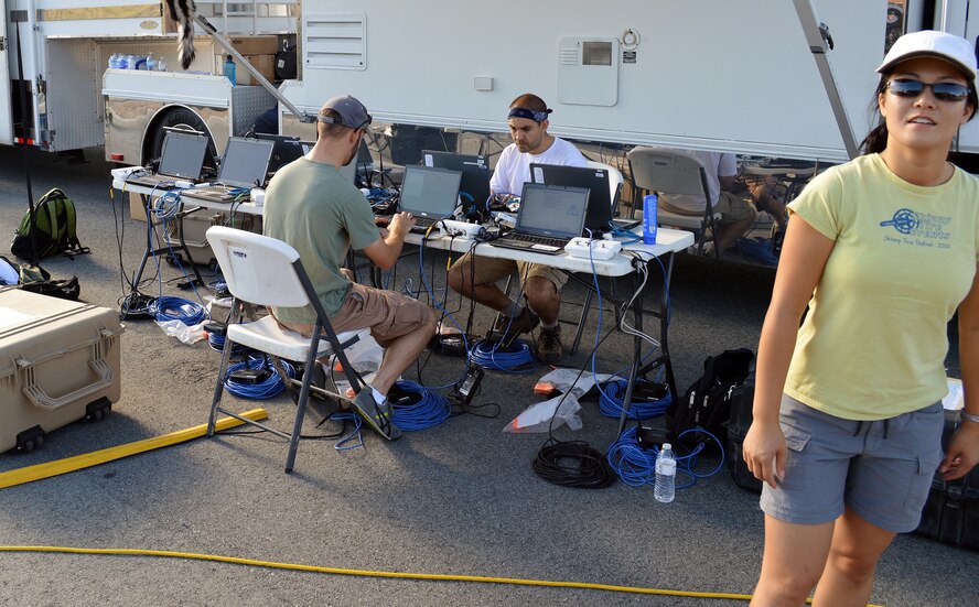 A table full of computers and miles of wire made up part of the AFMC team’s entry in the Air Force Research Laboratory’s Commander’s Challenge. The team, which included, from left, James Brewer, Daniel Gallagher and Joann Luu, developed a technological solution to detect unmanned aerial vehicles in an urban setting. Luu is from the 519th Software Maintenance Squadron at Hill AFB, Utah. (Courtesy photo)