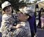 Army Staff Sgt. Cristian Arreaza, 555 Transportation Coordination Detachment, says goodbye to Halia, 4, daughter of Arreaza’s partner, during a sendoff ceremony held in El Monte, Calif., Jan. 13. The unit will be deploying in support of Operation Enduring Freedom. (U.S. Army photo by SGT Tracy Ellingsen)