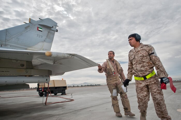 A United Arab Emirates Air Force pilot and crew chief perform a pre-flight inspection on a Mirage 2000-9 aircraft prior to a Red Flag 13-2 mission on the Nellis Air Force Base flight line Jan. 23, 2013. Red Flag provides coalition air forces the opportunity to train air combat operations in a safe training environment. (U.S. Air Force photo by Lawrence Crespo)