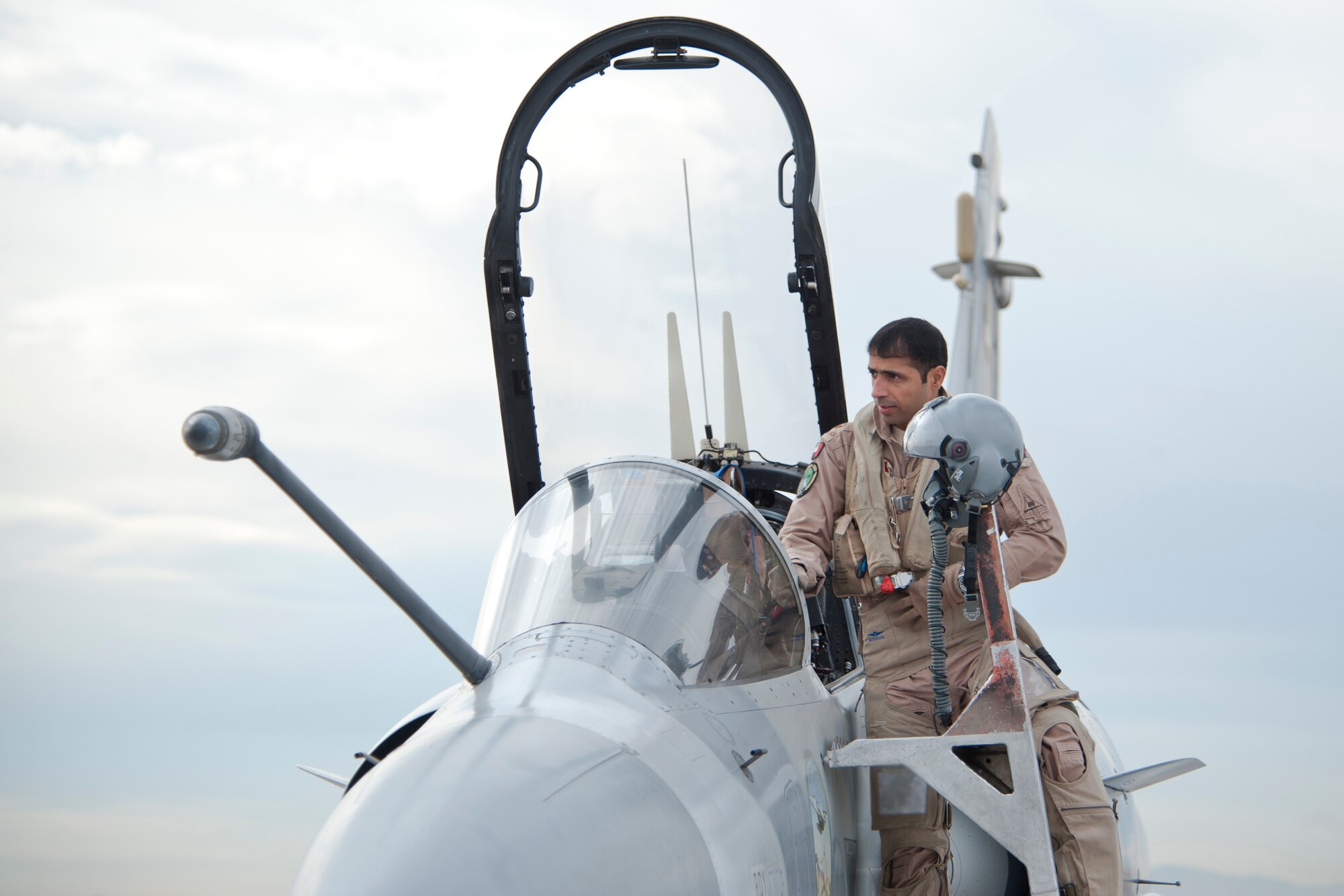 A United Arab Emirates Air Force pilot enters his Mirage 2000-9 aircraft on the Nellis Air Force Base flight line Jan. 23, 2013. Six UAEAF aircraft will train joint air-to-air tactics on the Nevada Test and Training Range north of Las Vegas during Red Flag 13-2. (U.S. Air Force photo by Lawrence Crespo)