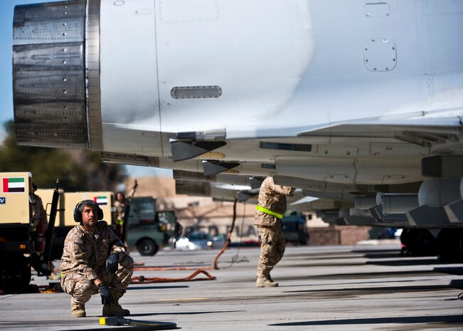 United Arab Emirates Air Force Warrant Officer Amed Alhosany observes underneath a Mirage 2000-9 during pre-flight checks at Red Flag 13-2, Jan. 22, 2013, at Nellis Air Force Base, Nev. Approximately 120 people from the UAE Air Force will participate in the two-week long Red Flag exercise. (U.S. Air Force photo/Senior Airman Brett Clashman)