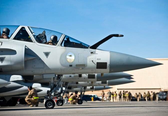 Members of the United Arab Emirates Air Force conduct pre-flight checks on Mirage 2000-9 aircraft during Red Flag 13-2, Jan. 22, 2013, at Nellis Air Force Base, Nev. This is the first appearance for the Mirage 2000-9 in a Red Flag exercise. (U.S. Air Force photo/Senior Airman Brett Clashman)