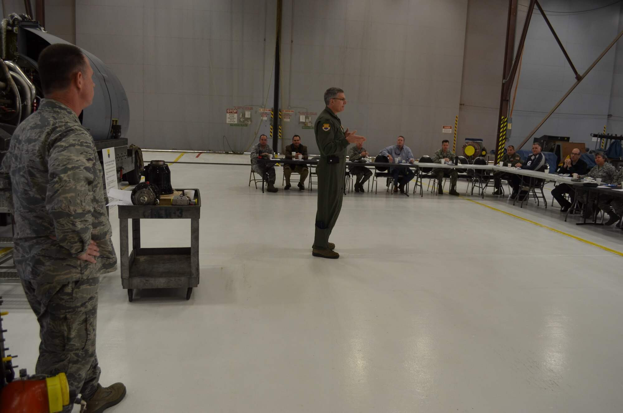 Col. Charles Combs, left, 433rd Maintenance Group commander, looks on as Col. Aaron Vangelisti, 433rd Airlift Wing vice commander, greets 15 visiting Honorary Commanders for their first event as commanders, Jan. 18, 2013. Commanders visited  various shops within  mainteance group.  The Honorary Commander program assigns area civic leaders with wing senior leadership to teach them about the wing's role within the Reserve forces, the U.S. Air Force, and the national defense.  