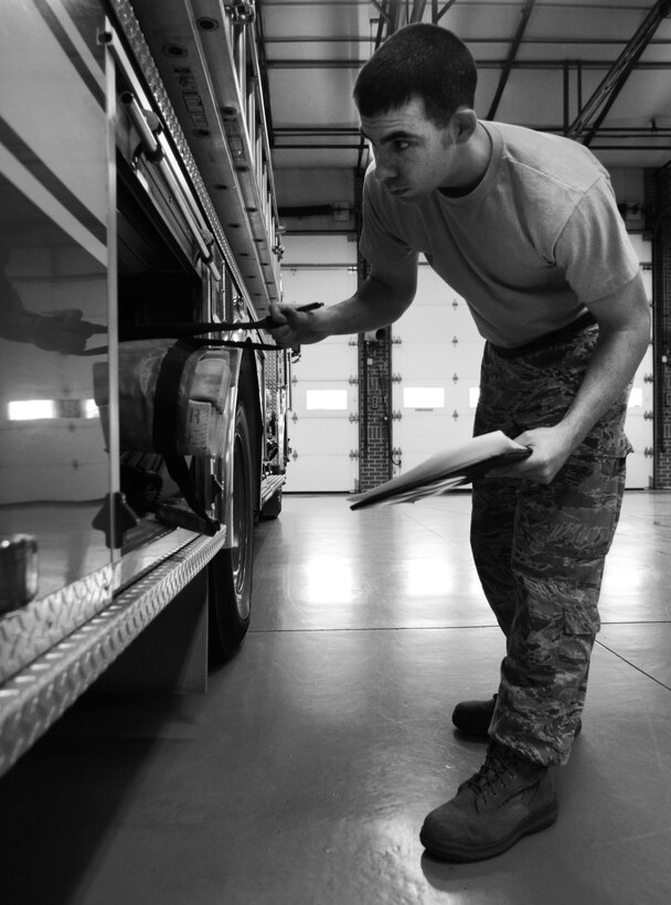 U.S. Air Force Staff Sgt. Derek Dobbins, 633rd Civil Engineer Squadron fire department crew chief, performs a maintenance check on a high-pressure water hose attached to an alert vehicle at the fire department on Langley Air Force Base, Va., Jan. 15, 2013. These water levels must be monitored daily to ensure vehicles are equipped and ready to respond to an emergency. (U.S. Air Force photo by Staff Sgt. Jeff Nevison/Released)