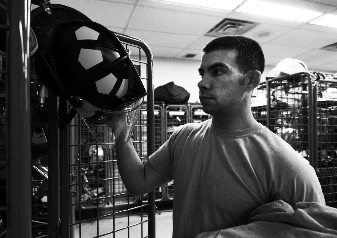 U.S. Air Force Staff Sgt. Derek Dobbins, 633rd Civil Engineer Squadron fire department crew chief, trains for a possible emergency at the fire department on Langley Air Force Base, Va., Jan. 15, 2013. Personnel at Langley’s Fire Department have 60 seconds to board an alert vehicle, and five minutes to respond on-scene to an incident after receiving an alarm. (U.S. Air Force photo by Staff Sgt. Jeff Nevison/Released)