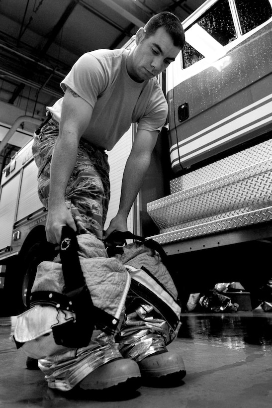U.S. Air Force Staff Sgt. Derek Dobbins, 633rd Civil Engineer Squadron fire department crew chief, trains for a possible emergency at the fire department on Langley Air Force Base, Va., Jan. 15, 2013. Personnel at Langley’s Fire Department have 60 seconds to board an alert vehicle, and five minutes to respond on-scene to an incident after receiving an alarm. (U.S. Air Force photo by Staff Sgt. Jeff Nevison/Released)