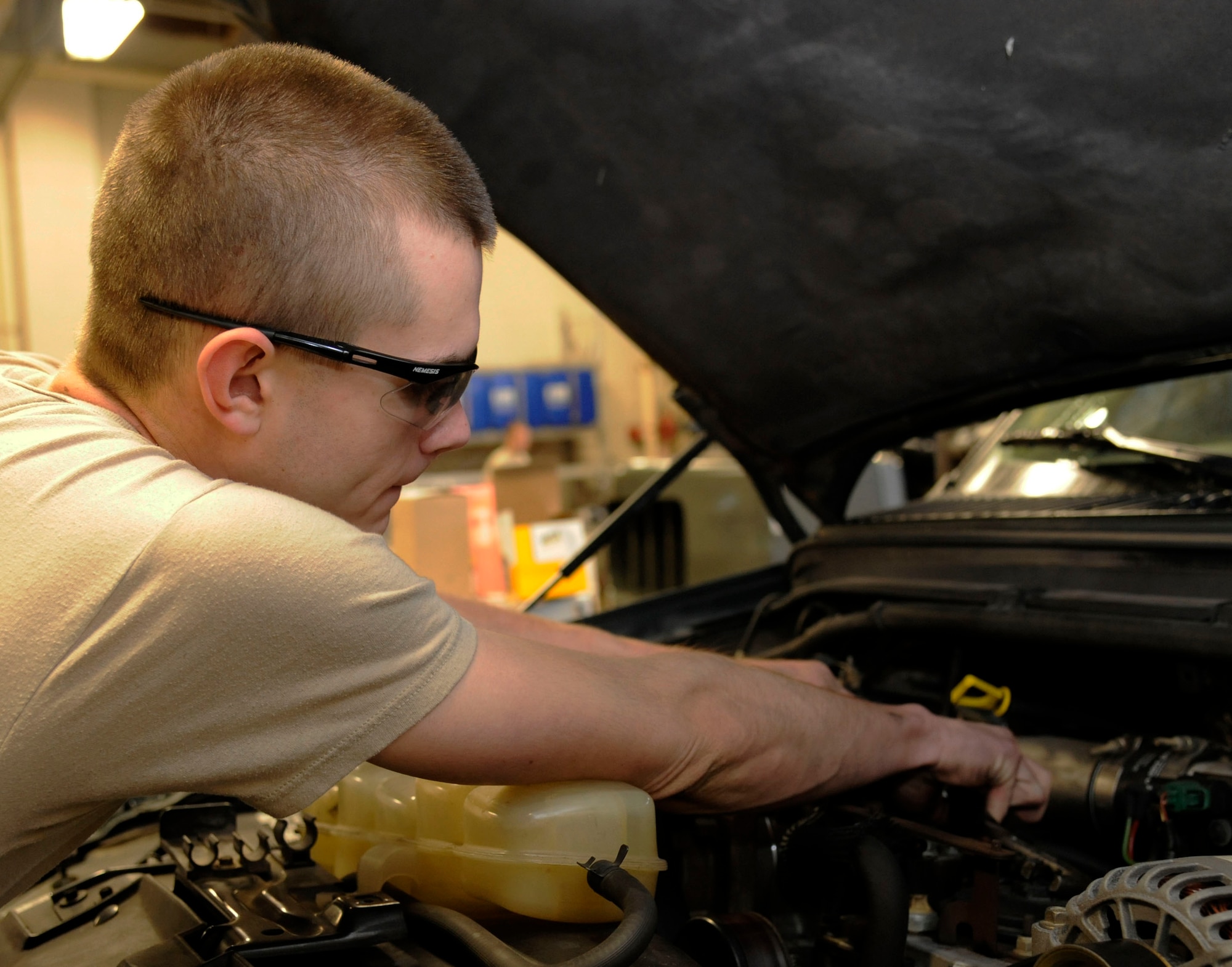 Airman 1st Class Kenneth Bates, 2nd Logistics Readiness Squadron vehicle maintenance section, replaces a fuel filter on Barksdale Air Force Base, La., Jan. 24. The vehicle maintenance section maintains a wide range of vehicles to include Humvees, every day-use vehicles, buses and maintenance trucks used to tow aerospace ground equipment. (U.S. Air Force photo/Airman 1st Class Andrew Moua)