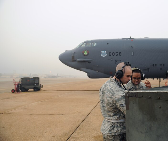 Airmen 1st Class Austin Smith, 2nd Maintenance Squadron, and Johnny King, 20th Aircraft Maintenance Unit crew chief, power up an aircart on Barksdale Air Force Base, La., Jan. 24. The aircart is used to start one engine which in turn starts the rest of the engines on the aircraft. (U.S. Air Force photo/Airman 1st Class Benjamin Gonsier)