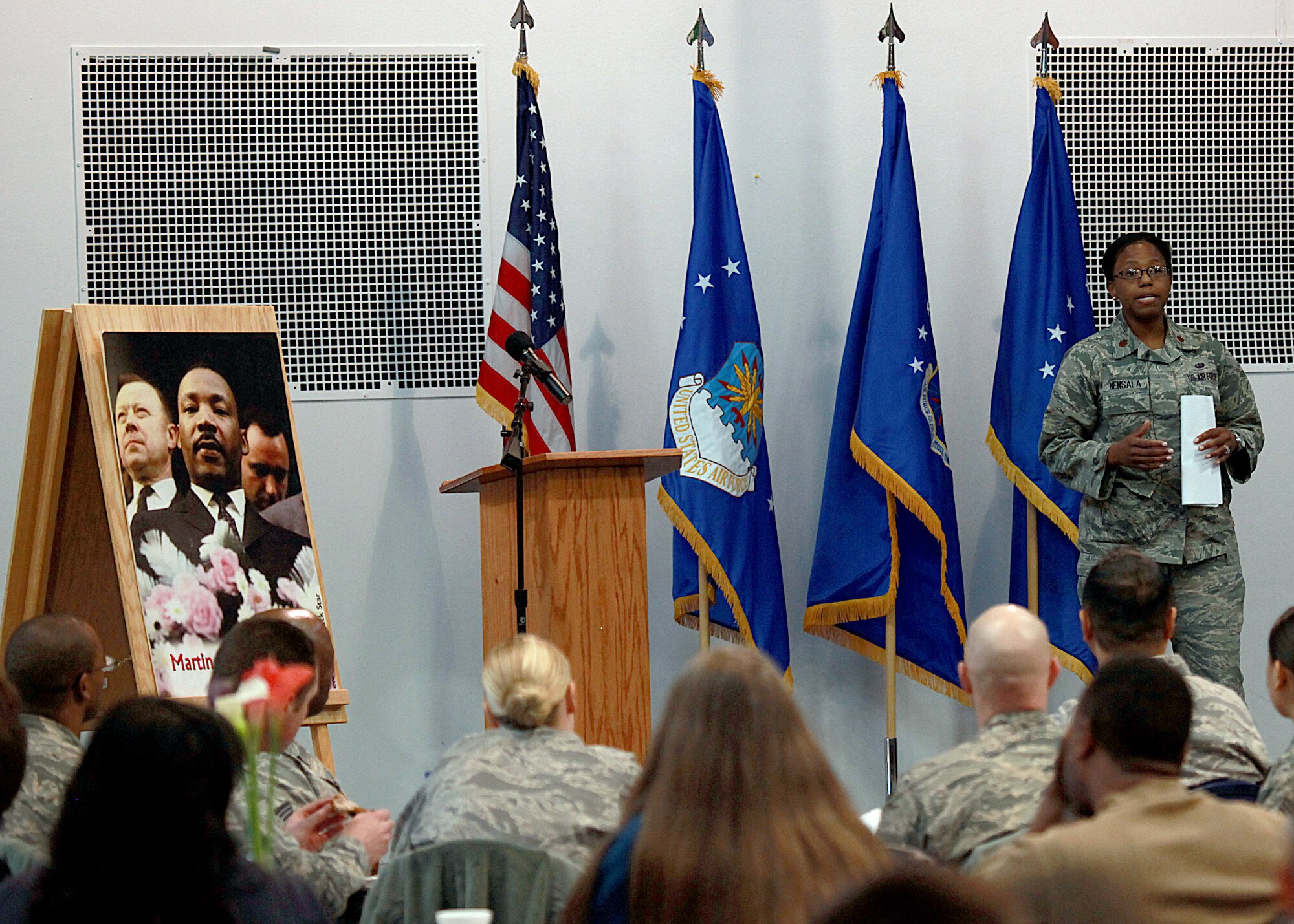 Maj. Sondra Nensala, 90th Missile Wing deputy staff judge advocate, delivers the keynote speech during F. E. Warren’s Martin Luther King, Jr., Birthday Observance in the Fall Hall Community Center Jan. 16. (U.S. Air Force photo by Matt Bilden)