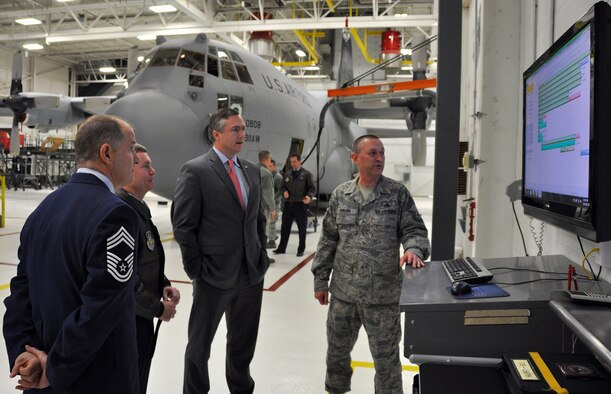 Chief Master Sgt. Brian L. Zator, 911th Airlift Wing financial services; Col. Craig C. Peters, commander of the 911th AW; and Pennsylvania State Senator Matt Smith receive brief by Chief Master Sgt. Terrance J.  Keblish, 911th Maintenance Squadron superintendent, on the 911th’s benchmark aircraft maintenance isochronal inspection process. January 15, 2013. Smith, the newly elected member of the Pennsylvania Senate serving the 37th Senatorial District, visited the base to become more familiar with and informed on the global mission and strategic importance of the 911th AW to national defense. Smith was also provided a base tour, which included a look at the progress of construction on the Navy Operations Support Center and a guided tour of the newly built hospitality lodge, which recently received a gold certification for building under the Leadership in Energy and Environmental Design Certification System. (U.S. Air Force photo by Senior Airman Joseph E. Bridge/Released)