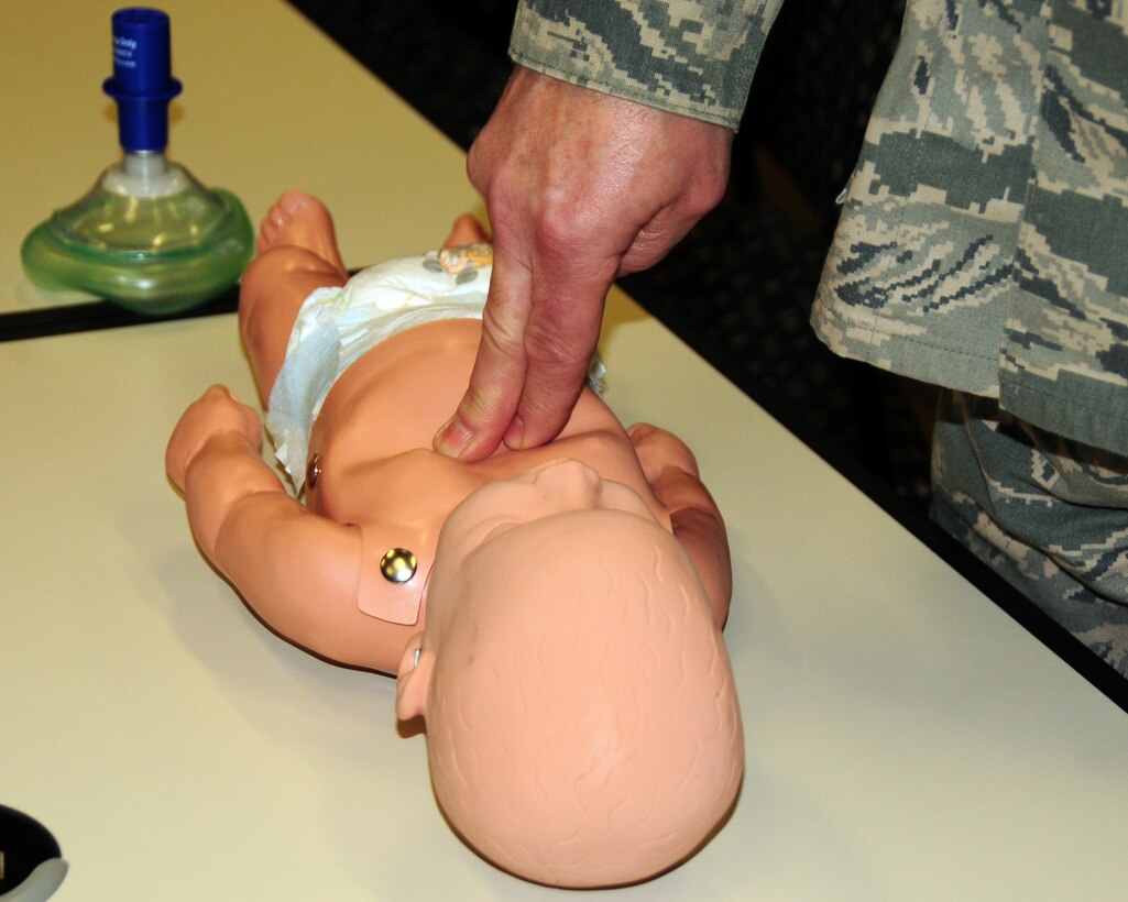 Only two fingers are required to perform compression, part of the Cardio Pulmonary Resuscitation (CPR) procedure on an infant as seen here on a training mannequin during a CPR class at the Niagara Falls Air Reserve Station, N.Y. on January 23, 2013.. (U.S. Air Force photo by Peter Borys)
