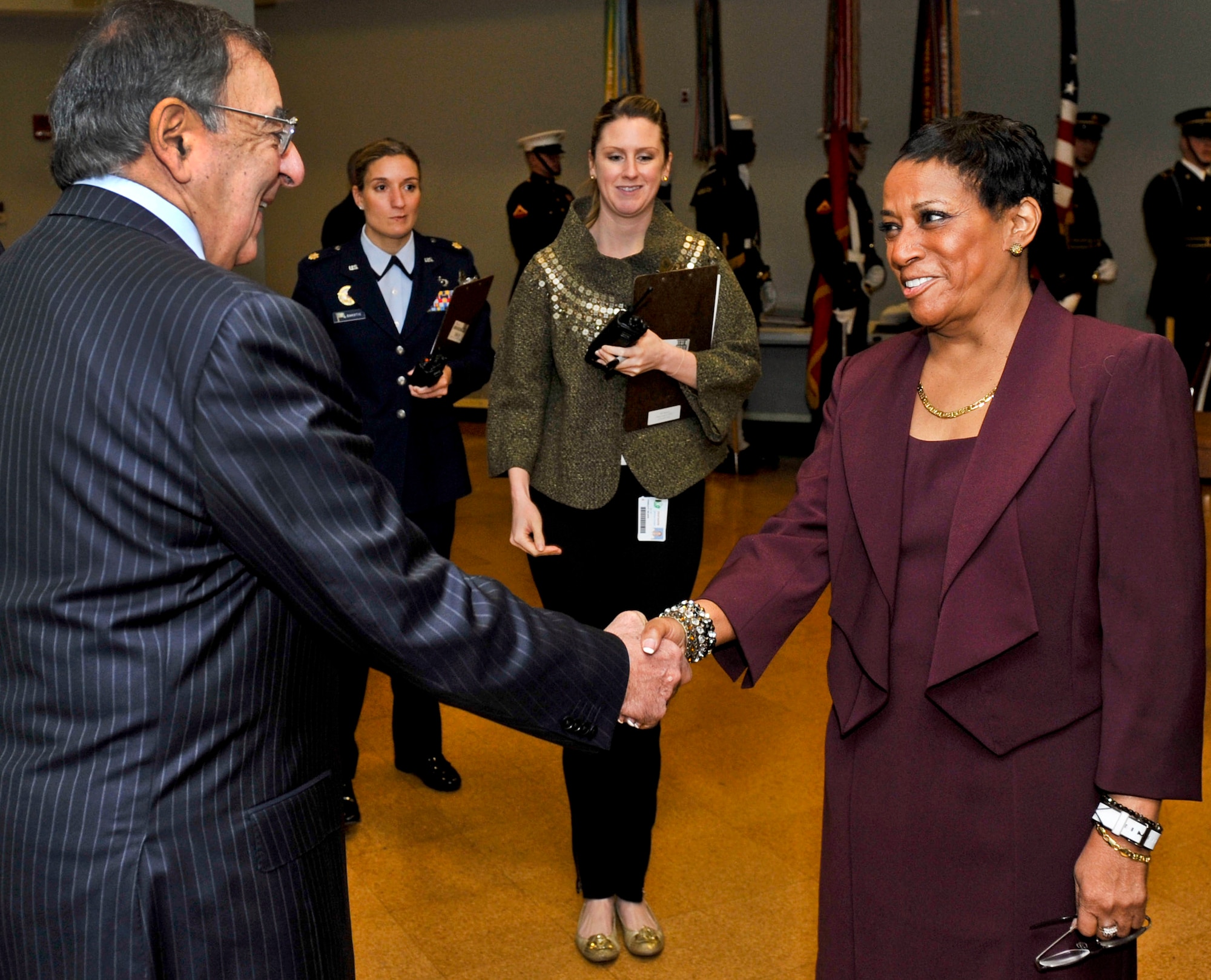 Defense Secretary Leon E. Panetta shakes hands with retired Air Force Maj. Gen. Marcelite J. Harris before they deliver remarks during the Defense Department's 28th annual Martin Luther King Jr. observance at the Pentagon, Jan. 24, 2013. (Defense Department photo/Glenn Fawcett) 
