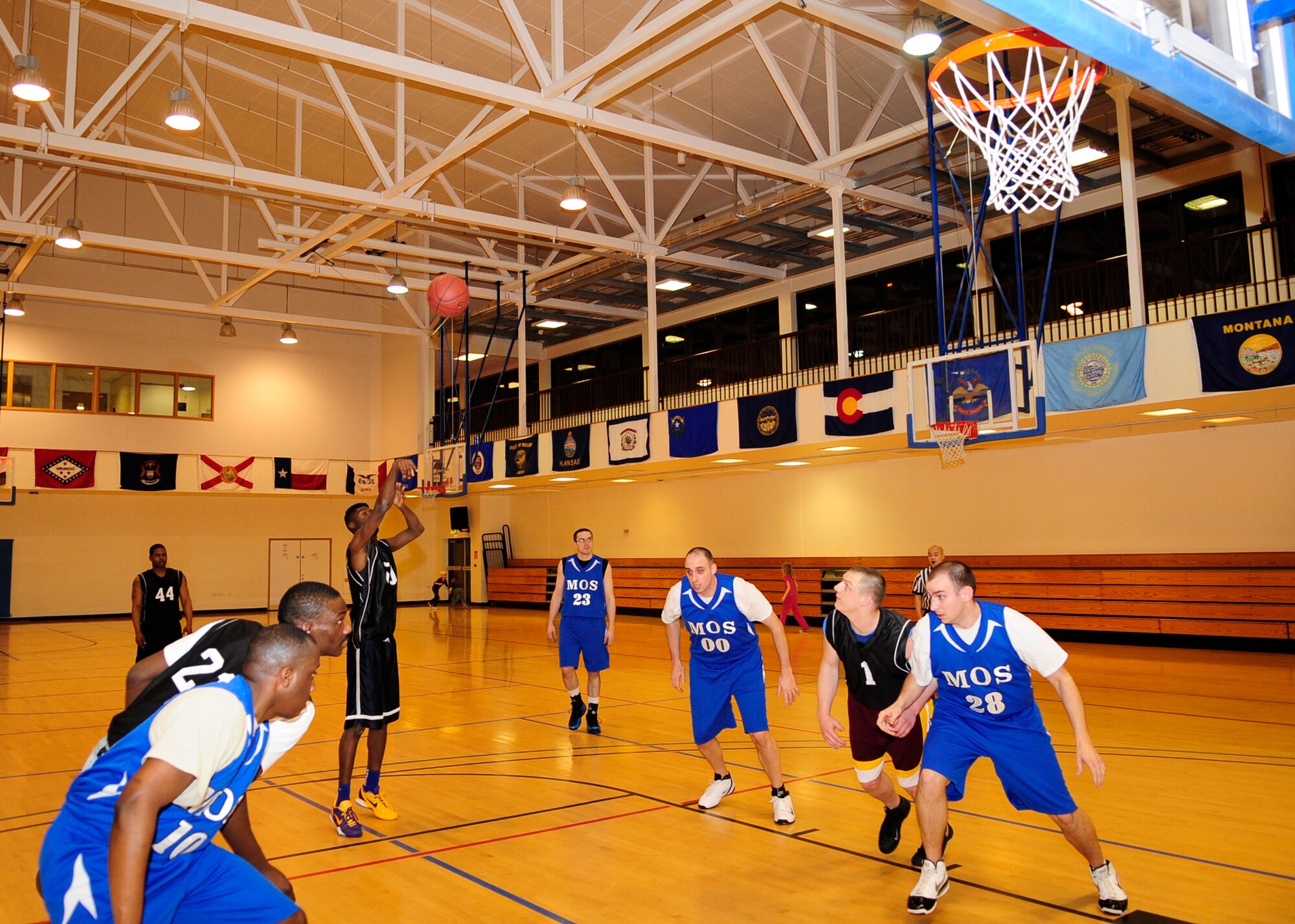 Airman 1st Class Jarvis Tinsley, 100th Maintenance Squadron fuels systems apprentice, shoots a free throw during an intramural basketball game between the 100th Maintenance Group and the 100th Maintenance Operations Squadron Jan. 24, 2013, at the Hardstand Fitness Center on RAF Mildenhall, England. The 100th MXG was victorious over the 100th MOS with a final score of 54-28. (U.S. Air Force photo by Airman 1st Class Dillon Johnston/Released)