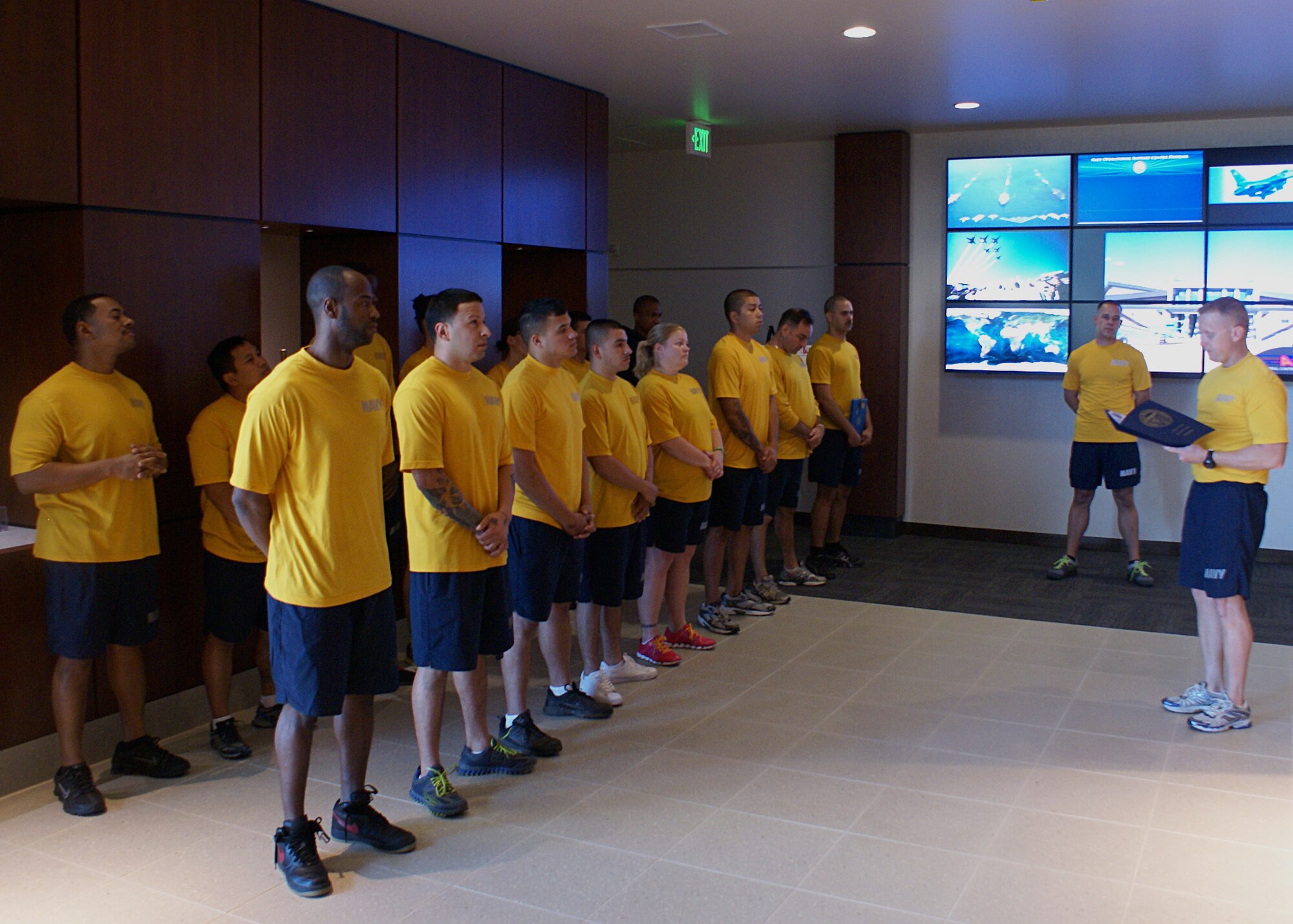 Lt. Cmdr. Raymond Fryberger, Navy Operations Supply Center executive officer, reads an award to the staff recently during morning quarters. The NOSC’s overall mission is to ensure the units they support are mobilized and ready to deploy at all times. (Courtesy photo)