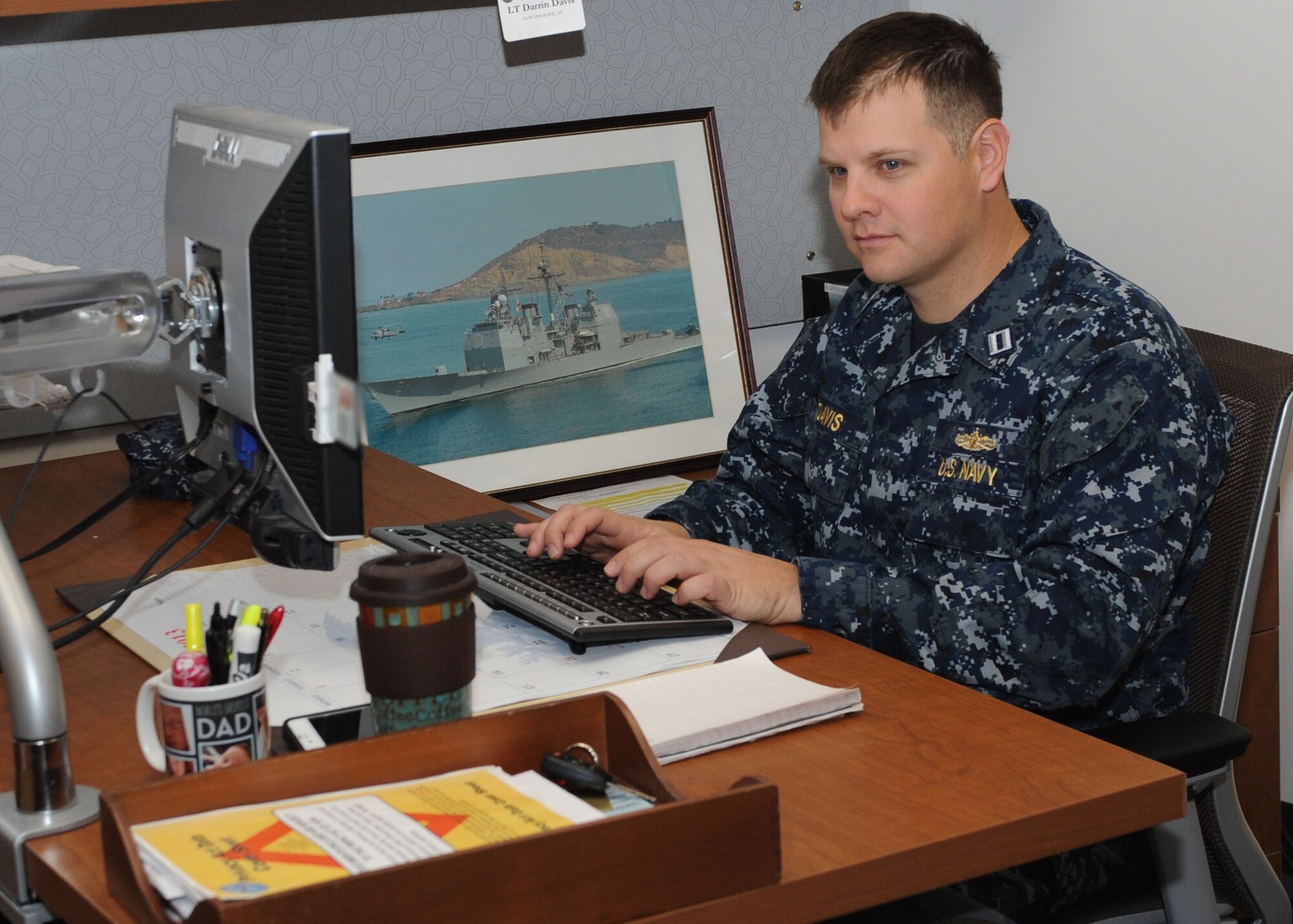 U.S. Navy Lieutenant Darrin Davis, Navy Operations Support Center security manager, works on security clearances Jan. 16 for sailors assigned to the NOSC personnel center. (U.S. Air Force photo/Airman 1st Class Devante Williams)