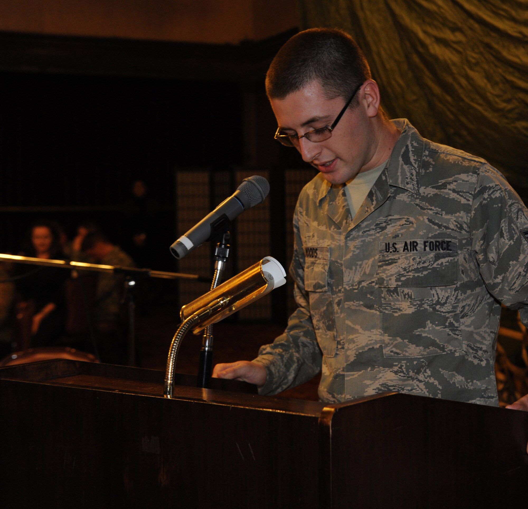 U.S. Air Force Airman 1st Class Chandler Woods, 18th Equipment Maintenance Squadron aerospace ground equipment journeyman, blesses the meal during the National Prayer Luncheon on Kadena Air Base, Japan, Jan. 24, 2013. The first Presidential Prayer Breakfast was started by members of Congress and President Dwight D. Eisenhower on Feb. 5, 1953. (U.S. Air Force photo/Airman 1st Class Malia Jenkins)