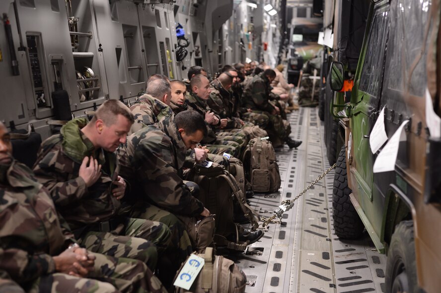 French troops prepare for take-off inside a U.S. Air Force C-17 Globemaster III cargo aircraft in Istres, France, Jan. 21, 2013. France deployed military to the African country of Mali to fight forces who threaten the current Mali government's stability and are relying on assistance from allies in transporting troops and supplies. (U.S. Air Force photo/Staff Sgt. Nathanael Callon)
