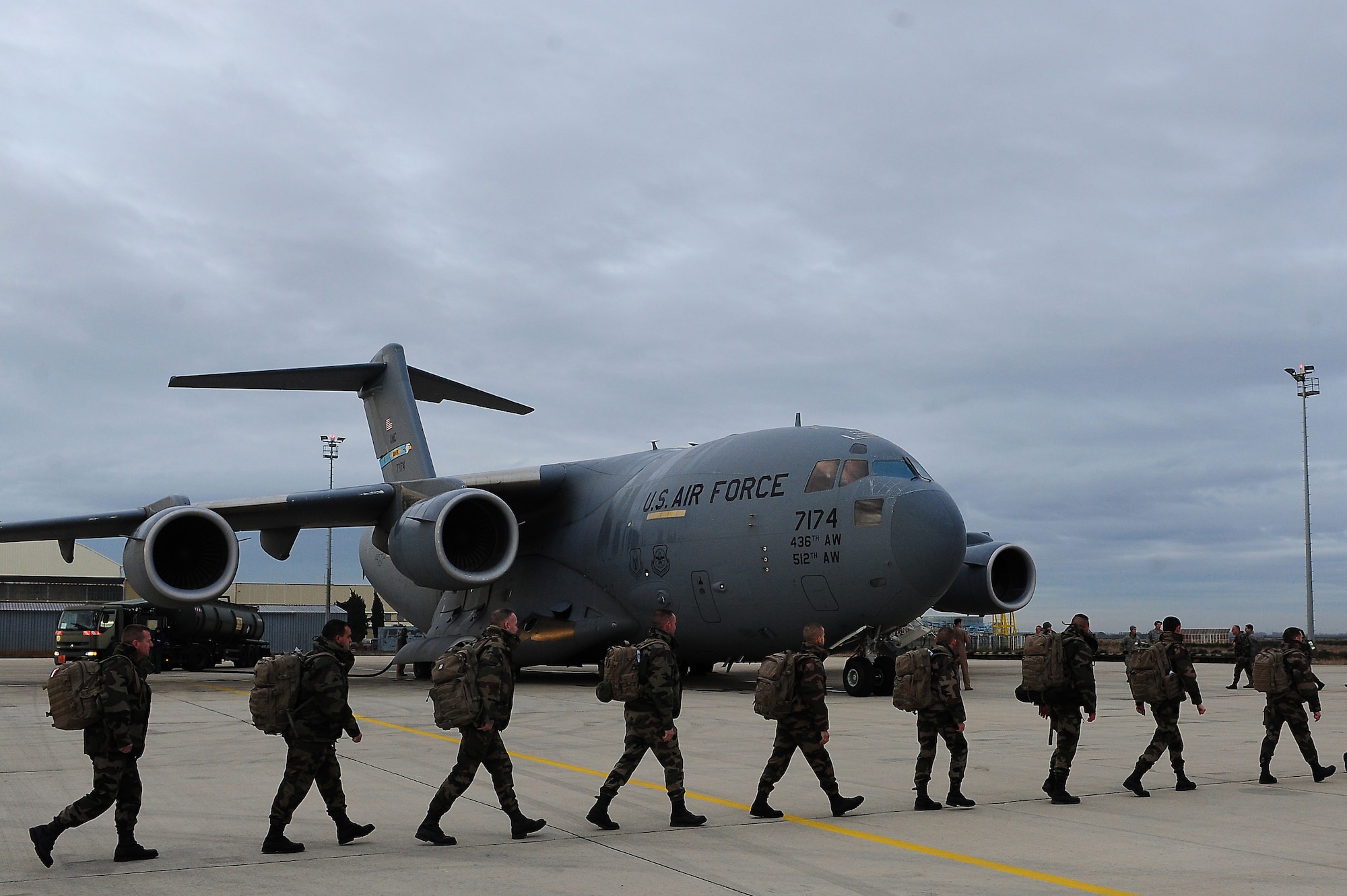 ISTRES, France - French soldiers march to a U.S. Air Force C-17 Globemaster III in support of missions in the Republic of Mali. The United States has agreed to help France airlift troops and equipment into Mali. (U.S. Air Force photo by Senior Airman James Richardson/Released)