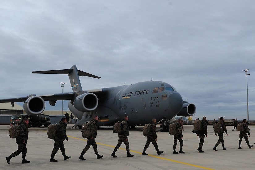 ISTRES, France - French soldiers march to a U.S. Air Force C-17 Globemaster III in support of missions in the Republic of Mali. The United States has agreed to help France airlift troops and equipment into Mali. (U.S. Air Force photo by Senior Airman James Richardson/Released)