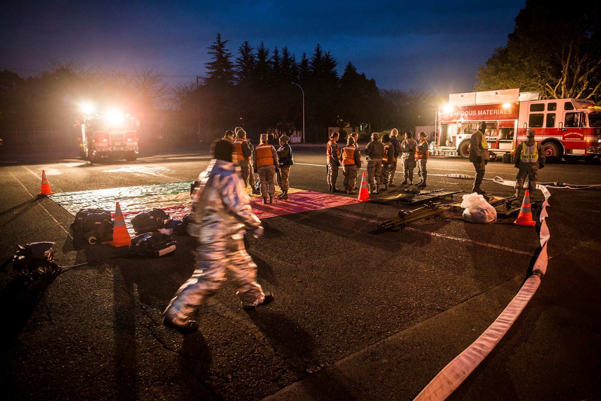 YOKOTA AIR BASE, Japan -- Emergency crews tend to simulated victims during an emergency management exercise at Yokota Air Base, Japan, Jan. 22, 2013. EMEs test the base's ability to respond to an emergency situation. (U.S. Air Force photo by Tech. Sgt. Samuel Morse)