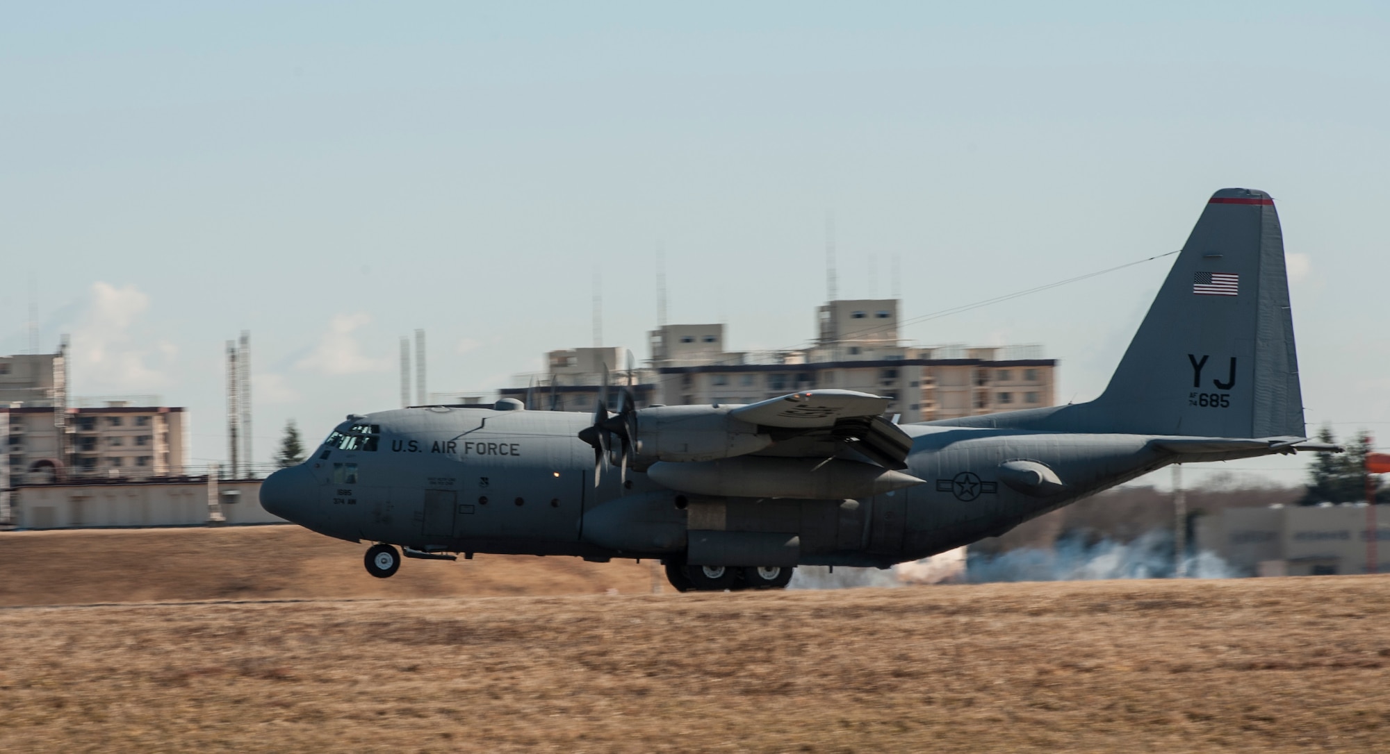 YOKOTA AIR BASE, Japan -- A C-130 Hercules lands at Yokota Air Base, Japan, Jan. 19, 2013. The aircraft carried personnel returning from deployment to Southwest Asia. (U.S. Air Force photo by Tech. Sgt. Samuel Morse)