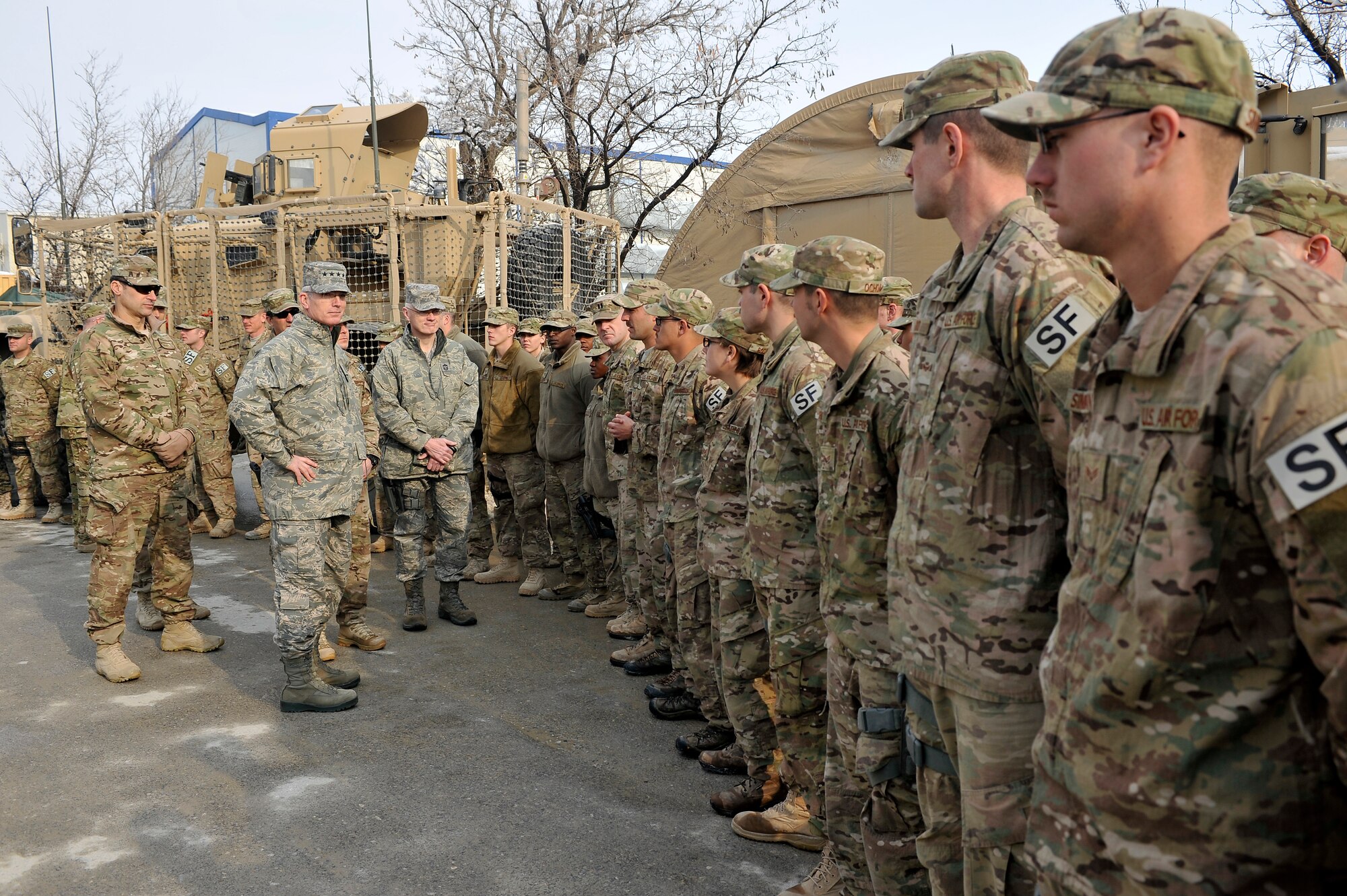 Gen. Paul J. Selva, Air Mobility Command commander, and Chief Master Sgt. Richard A. Kaiser, Command Chief Master Sergeant for Air Mobility Command, greet members of the 455th Air Expeditionary Wing at Bagram Airfield, Afghanistan, Jan. 17, 2013. Airmen were able to meet with AMC leadership and highlight what they and their unit bring to the BAF mission. (U.S. Air Force photo/Senior Airman Chris Willis/Released)
