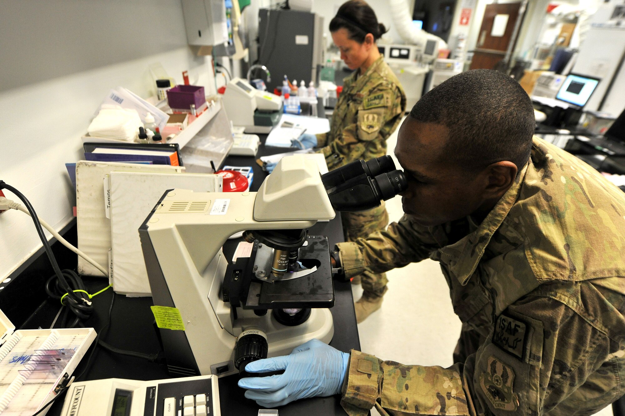 Tech. Sgt. Terrence Raybon and Tech. Sgt. Camelin Riley, 455th Expeditionary Medical Support Squadron laboratory technicians, review and inventory donor blood at the Craig Joint Theater Hospital on Bagram Airfield, Afghanistan, Jan. 24, 2013. The hospital lab technicians constantly monitor the stocked blood through quality control measures to ensure safety and proper distribution to the hospital patients. (U.S. Air Force photo/Senior Airman Chris Willis)