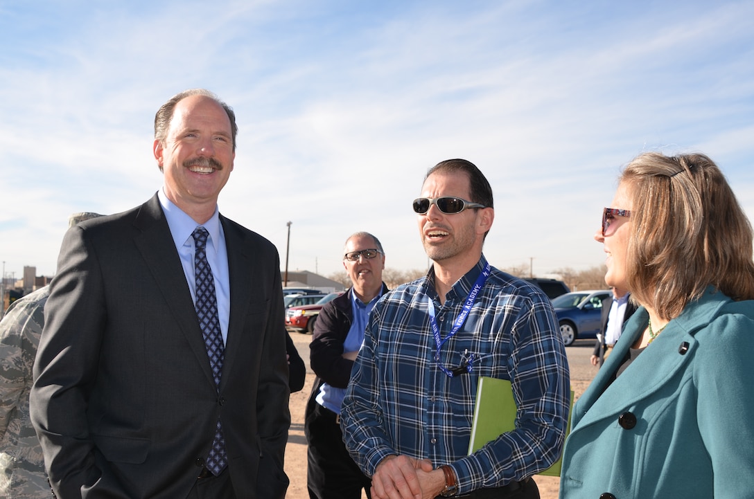 KIRTLAND AIR FORCE BASE, N.M., -- (L-R): Albuquerque Mayor Richard J. Berry; John Fleck, Albuquerque Journal; Walter Migdal, project manager with the Albuquerque District; Diane Agnew, Shaw Environmental & Infrastructure Group visit during the Mayor's tour of the newly upgraded fuel plume remediation equipment Jan. 23 at the base's bulk fuel facility site.




