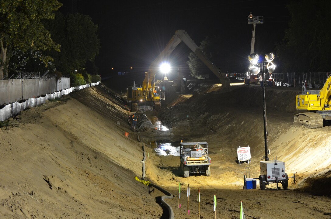 Construction crews work in darkness--when energy demand is lowest--on a stretch of American River levee near the California State University-Sacramento campus Sept. 12, 2012 to close a 900-foot-long gap in a seepage cutoff wall underneath high power lines. 
The Corps has built more than 20 miles of seepage walls into American River levees since 2000. Areas where construction was complicated by utilities, bridges or power lines were set aside for later construction.
The project is part of the American River Common Features project, a joint flood risk reduction effort between the Corps, the state’s Central Valley Flood Protection Board/Department of Water Resources and the Sacramento Area Flood Control Agency.