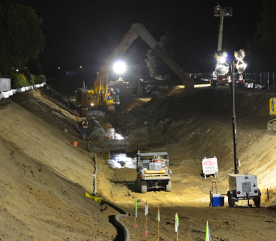 Construction crews work in darkness--when energy demand is lowest--on a stretch of American River levee near the California State University-Sacramento campus Sept. 12, 2012 to close a 900-foot-long gap in a seepage cutoff wall underneath high power lines. The Corps has built more than 20 miles of seepage walls into American River levees since 2000. Areas where construction was complicated by utilities, bridges or power lines were set aside for later construction. The project is part of the American River Common Features project, a joint flood risk reduction effort between the Corps, the state’s Central Valley Flood Protection Board/Department of Water Resources and the Sacramento Area Flood Control Agency. 