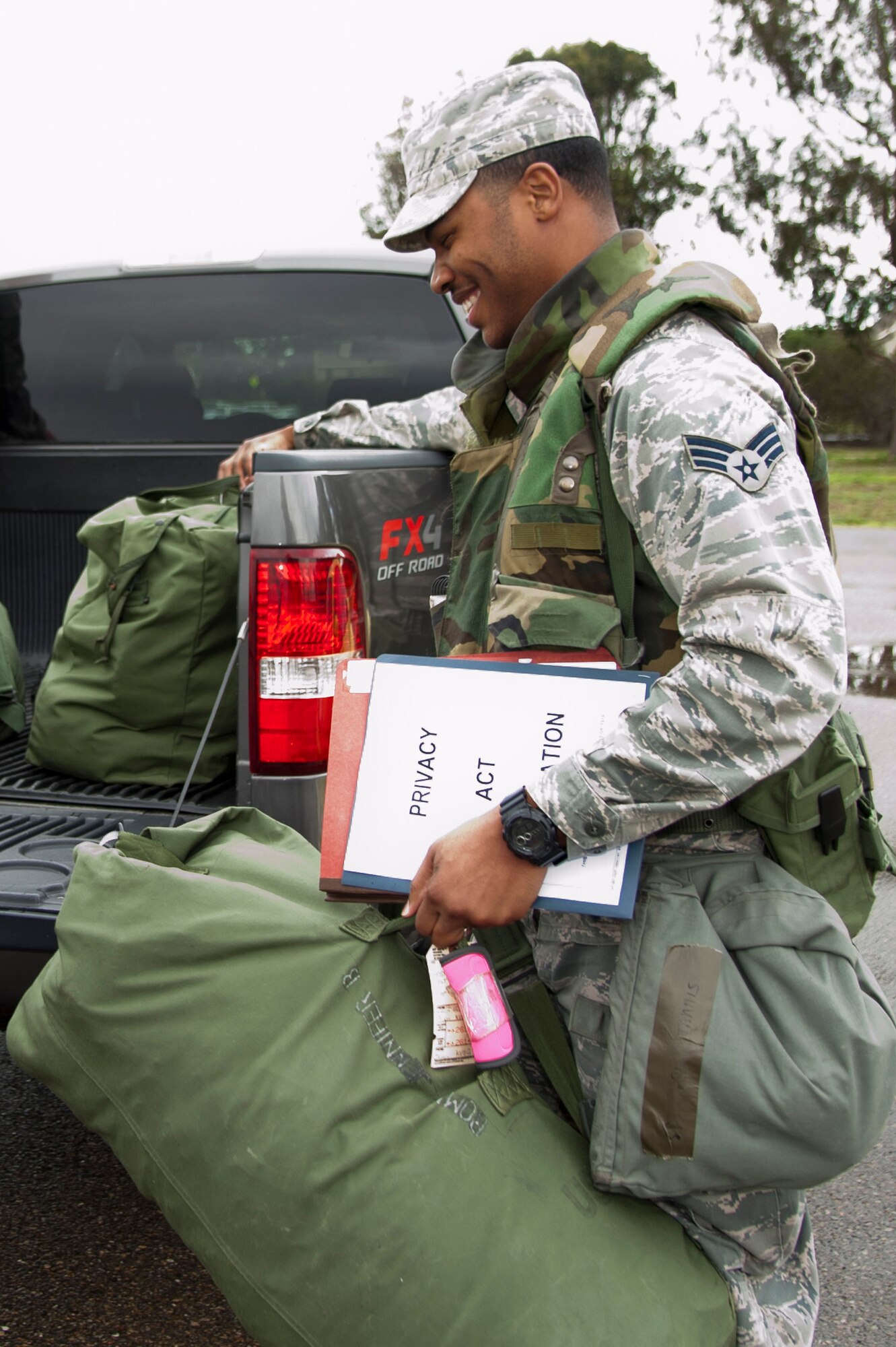 VANDENBERG AIR FORCE BASE, Calif. – Senior Airman Darian Tannis, 30th Staff Judge Advocate civil law paralegal, loads a mobility bag onto a truck during a unit compliance inspection exercise deployment here Friday, Jan. 25, 2013. A mobility bag consists of items essential for an Airman to have when tasked to deploy at a moments notice. (U.S. Air Force photo/Senior Airman Lael Huss)