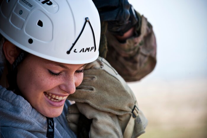 Tristen Guthrie, Junior Reserve Officer Training Corps cadet, fast-ropes down a rappel training tower Jan. 25, 2013, at Nellis Air Force Base, Nev. The mission of JROTC programs is to develop citizens of character dedicated to serving their nation and community. (U.S. Air Force photo/Senior Airman Brett Clashman)
