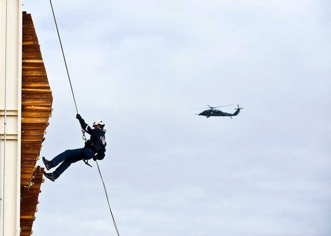 Angelo Hallenback, Junior Reserve Officer Training Corps cadet, receives assistance from U.S. Army ROTC instructors Jan. 25, 2013, at Nellis Air Force Base, Nev. U.S. Army ROTC instructors teamed with Nellis Airmen to provide a day-in-the-life experience of active duty military. (U.S. Air Force photo/Senior Airman Brett Clashman)