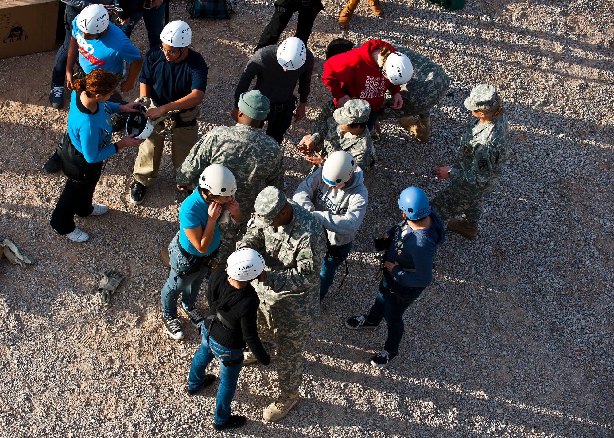 Junior Reserve Officer Training Corps cadets receive assistance from U.S. Army ROTC instructors Jan. 25, 2013, at Nellis Air Force Base, Nev. U.S. Army ROTC instructors teamed with Nellis Airmen to provide a day-in-the-life experience of active duty military. (U.S. Air Force photo/Senior Airman Brett Clashman)