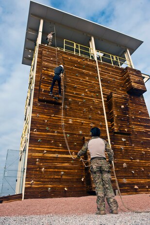 Hilda Rios, Junior Reserve Officer Training Corps cadet, rappels from a tower during a visit to Nellis Air Force Base, Nev. Jan. 25, 2013. The JROTC visit consisted of rappelling, a tour of the Thunderbird hangar and lunch at the Crosswinds Dining Facility. (U.S. Air Force photo/Senior Airman Brett Clashman)