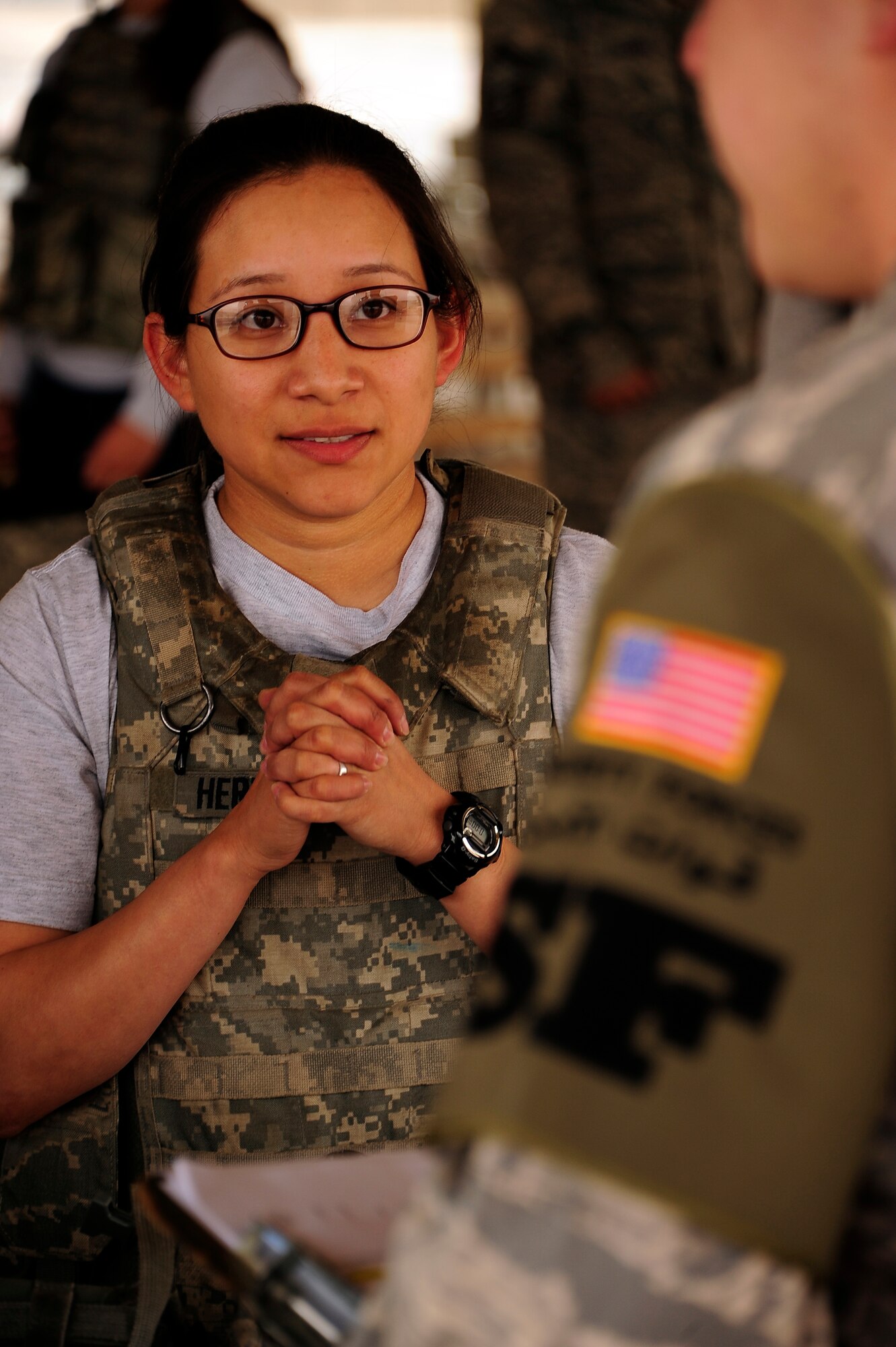 Senior Airman Anjelica Hernandez, 387th Expeditionary Security Forces Squadron, answers weapons knowledge questions during the Defender's Challenge competition at the 386th Air Expeditionary Wing. The Defender’s Challenge pitted ten four-person fire teams, in a six event timed competition consisting of a gear relay, Humvee push and down gunner litter relay, weapons knowledge, unexploded ordnance recognition and a job knowledge questionnaire. (U.S. Air Force photo by Senior Master Sgt. George Thompson)