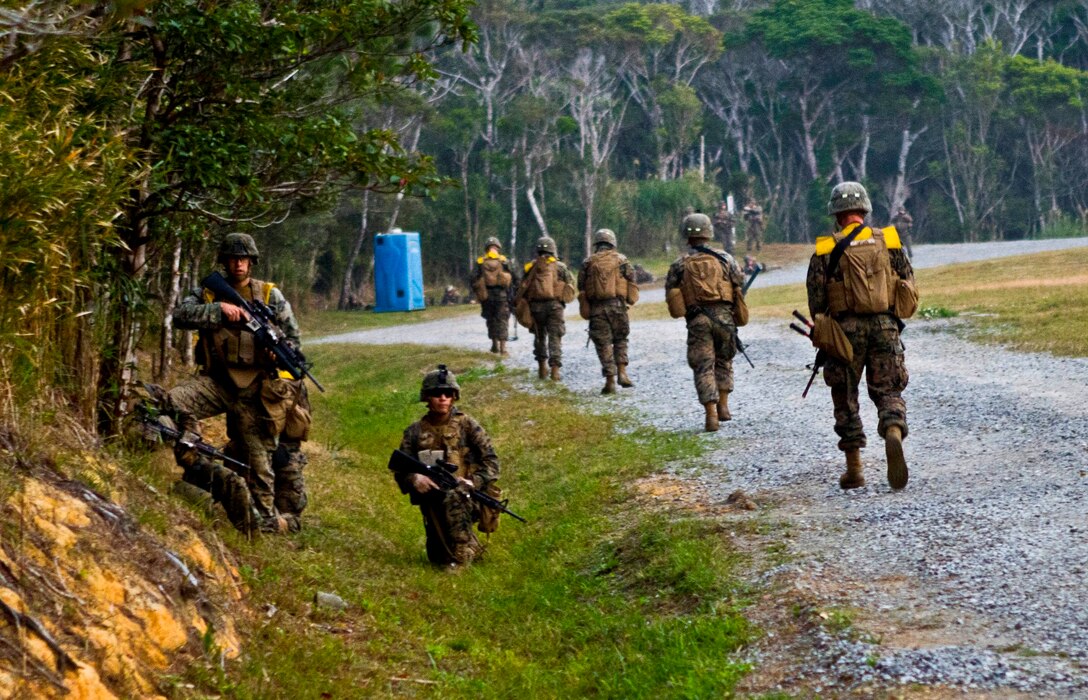 Marines and Sailors with Company A., Battalion Landing Team 1st Battalion, 5th Marine Regiment, 31st Marine Expeditionary Unit, sweep the area for improvised explosive devices during a mechanized raid here, Jan 24. The raid began from the USS Germantown (LSD-42), located off the coast of Okinawa, as part of their pre-deployment training for Spring Patrol 2013. The 31st MEU is the only continuously forward-deployed MEU and is the Marine Corps’ force in readiness in the Asia-Pacific region.