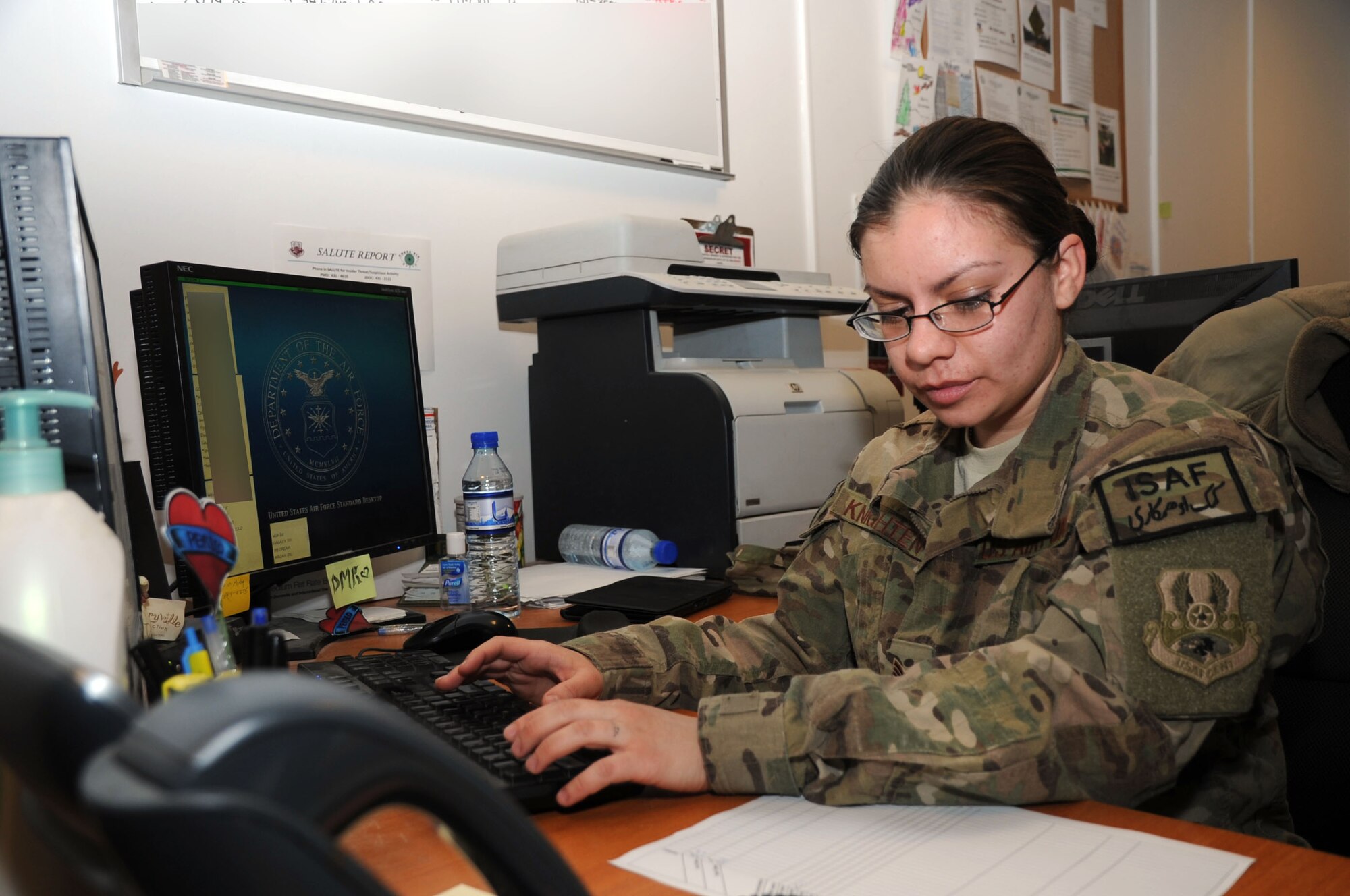 Airman 1st Class Delcarmen Knighten, 455th Expeditionary Force Support Squadron sustainment technician, updates a travel tracker sheet on Bagram Airfield, Afghanistan, Jan. 23, 2013. Knighten is part of the Personnel Support for Contingency Operations team which helps keep 100 percent accountability of Airmen assigned to the 455th Air Expeditionary Wing. (U.S. Air Force photo/Staff Sgt. David Dobrydney)