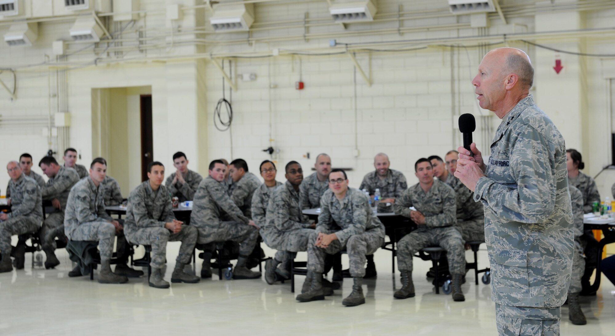 U.S. Air Force Chaplain (Maj. Gen.) Howard Stendahl, Air Force Chief of Chaplains, speaks to Airmen of the 18th Maintenance Group during a morale lunch on Kadena Air Base, Japan, Jan. 24, 2013. Stendahl visited Kadena on a pastoral visit, where he spoke at the Wired Bean and joined the 18th Civil Engineer Squadron for an Explosive Ordinance Disposal demonstration. (U.S. Air Force photo/Airman 1st Class Hailey R. Davis)