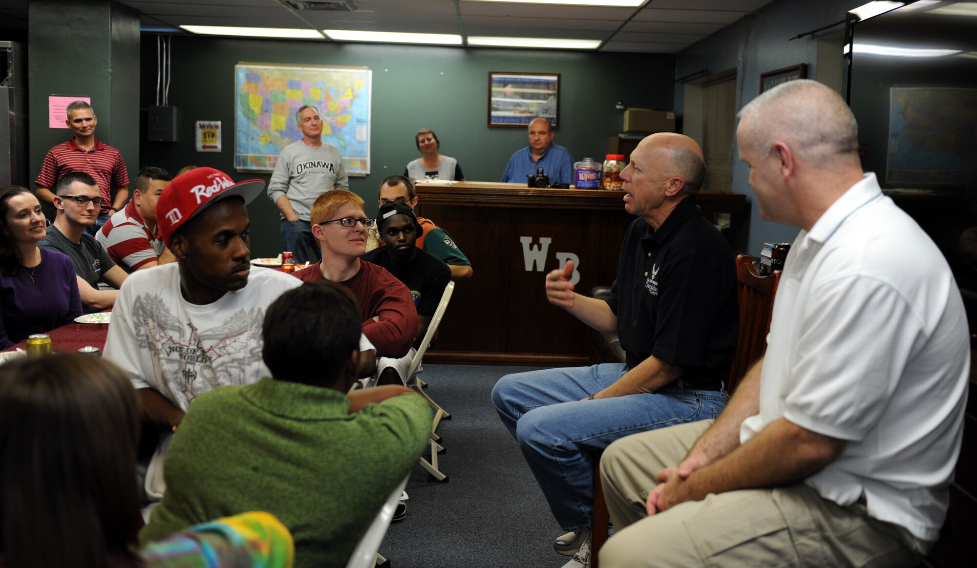 U.S. Air Force Chaplain (Maj. Gen.) Howard Stendahl, Air Force Chief of Chaplains, and Chief Master Sgt. Alton Clemmons, Air Force chaplain assistant career field manager, speak to Airmen at the Wired Bean during Ohana Night on Kadena Air Base, Japan, Jan. 23, 2013. Stendahl and Clemmons shared stories of their families and their experiences throughout their careers after sharing a meal with the Airmen. Ohana Night, which occurs every Thursday night at the Wired Bean, is a night where volunteers at the facility cook meals for the single Airmen that joined them for meals every week. (U.S. Air Force photo/Airman 1st Class Hailey R. Davis)