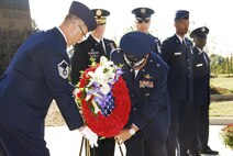 Family members, including those of recently honored aerial fire fighters and more than a thousand airmen of Charlotte's 145th Airlift Wing, North Carolina Air National Guard attend an annual memorial ceremony as a way to remember all airmen who had died in the year prior, whether a current or past member. Following a flyover of three C-130 Hercules, the aircraft used by the wing to accomplish its missions, the names are pronounced of any Air Guard member who has deceased over the last twelve months to a bagpipe rendition of "Amazing Grace," the formation of airmen at attention for a twenty-one gun salute, then a bugler performing "Taps," and the laying of a wreath in honor and remembrance of those who have passed. (National Guard photo by Senior Airman Laura Montgomery, 145th Public Affairs)