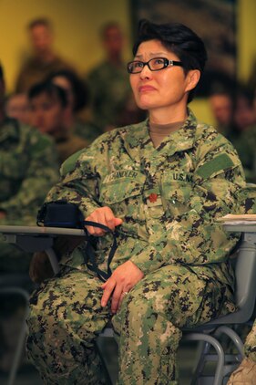 Lt. Cmdr. Helen Chandler, a registered nurse for the Intensive Care Unit in Kandahar, Afghanistan, holds back tears as she listens to a wounded warrior's heartbreaking story  during a pre-deployment at the Naval Expeditionary Medical Training Institute here Jan. 24.