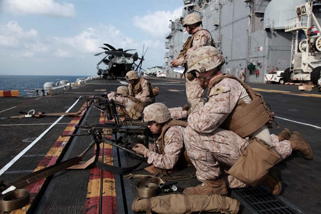 Marines with 81mm Mortars/Tactical Recovery of Aircraft and Personnel Platoon, Weapons Company, Battalion Landing Team 3/5, 15th Marine Expeditionary Unit, fire squad automatic weapons during a range on the flight deck of the USS Peleliu, Jan. 25. The 15th MEU is deployed as part of the Peleliu Amphibious Ready Group as a U.S. Central Command theater reserve force, providing support for maritime security operations and theater security cooperation efforts in the U.S. 5th Fleet area of responsibility. (U.S. Marine Corps photo by Cpl. John Robbart III)