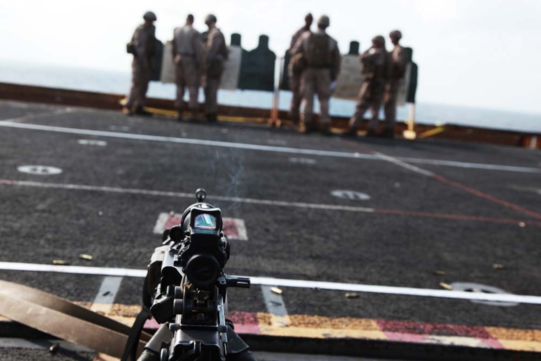 Marines with 81mm Mortars/Tactical Recovery of Aircraft and Personnel Platoon, Weapons Company, Battalion Landing Team 3/5, 15th Marine Expeditionary Unit, review their targets during a range on the flight deck of the USS Peleliu, Jan. 25. The 15th MEU is deployed as part of the Peleliu Amphibious Ready Group as a U.S. Central Command theater reserve force, providing support for maritime security operations and theater security cooperation efforts in the U.S. 5th Fleet area of responsibility. (U.S. Marine Corps photo by Cpl. John Robbart III)