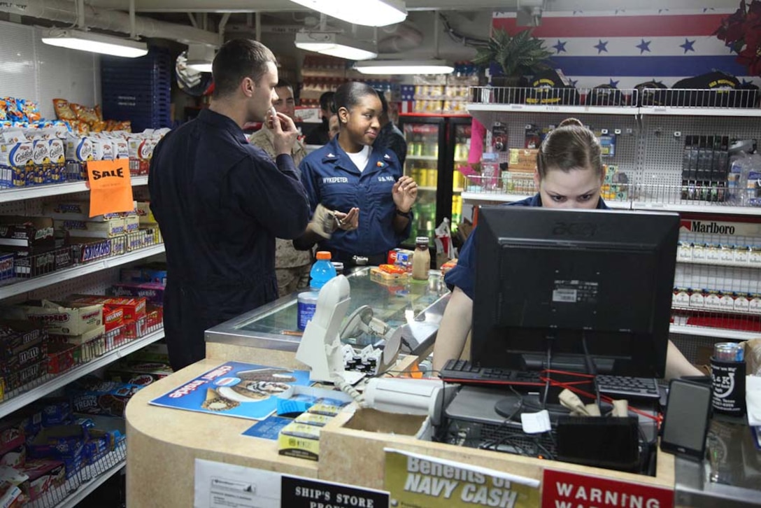 Marines and sailors shop in the ship store aboard the USS Rushmore, Jan. 20. The 15th Marine Expeditionary Unit is deployed as part of the Peleliu Amphibious Ready Group as a U.S. Central Command theater reserve force, providing support for maritime security operations and theater security cooperation efforts in the U.S. 5th Fleet area of responsibility. (U.S. Marine Corps photo by Cpl. Timothy R. Childers/Unreleased)