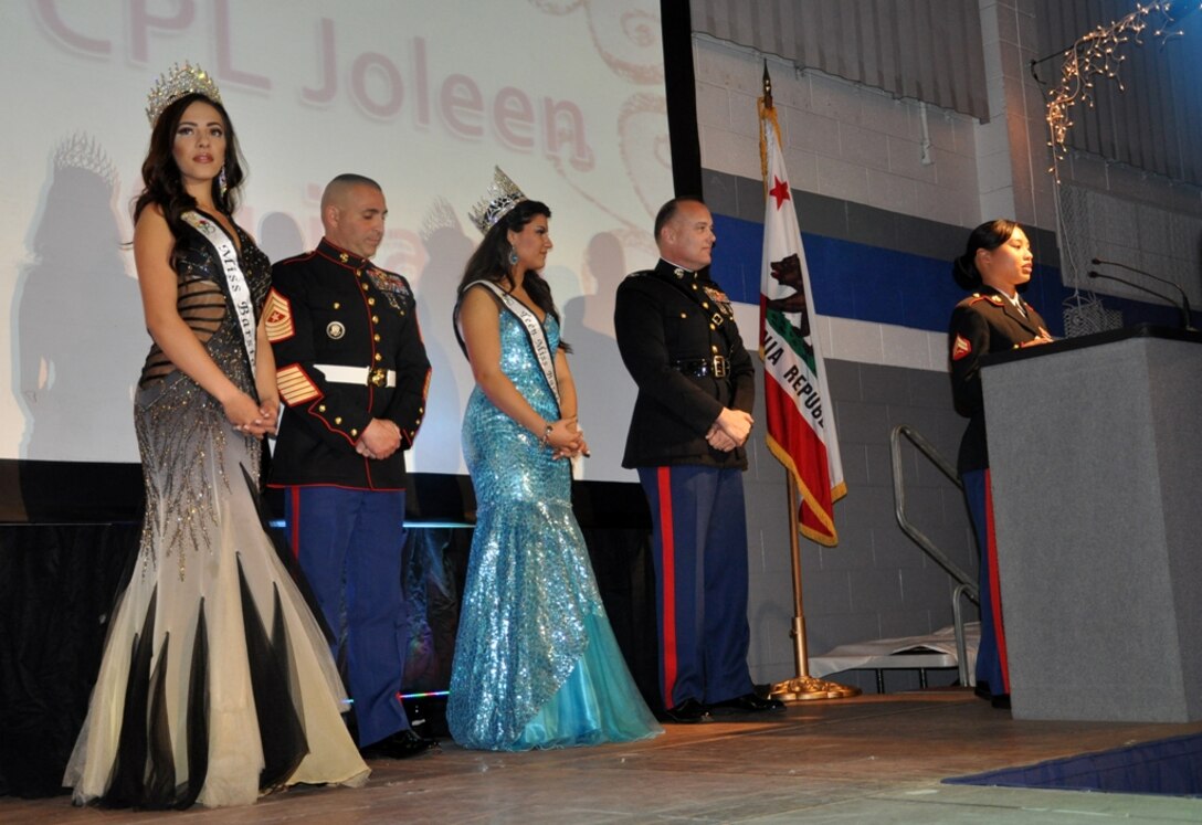 Cpl Joleen Quitano, MCLB Barstow's Marine of the Year, gives her acceptance speech at the 32nd Annual Barstow City Awards Banquet after being recognized  by the Barstow Area Chamber of Commerce on her accomplishment, Jan 26. The event, as explained by Diana Ross, chief executive of the chamber, is their annual academy awards program which also honors individuals, organizations, and events of the year. In the background are (from right to left) are: Col. Michael L. Scalise, commanding officer of MCLB, Teen Miss Barstow Nicole Gutierrez, Sgt. Maj. Richard Charron, base sergeant major, and Miss Barstow Charli Burnett.