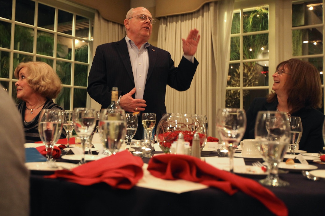 Michael G. Hire, director of the Navy-Marine Corps Relief Society Camp Pendleton, disclaimed some humorous remarks made by friends during his retirement dinner at the El Camino Country Club in Oceanside, Calif., Jan. 26.
