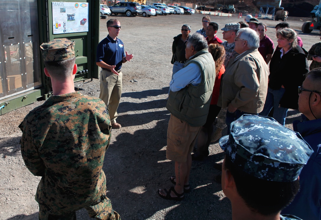 Ben Tritt, U.S. Marine Corps Forces Pacific science advisor with the Office of Naval Research, speaks to military personnel and a local community group here Jan. 25, on the intricacies of MAGS (Micro Auto Gasification System). The MAGS demonstration, supported by the MarForPac Experimentation Center, provided a forum for experts to explain the potential waste management solutions offered by waste-to-energy technology, as well as describe some of the environmental benefits of deploying MAGS and similar technology to austere environments. MAGS turns 95 percent of solid waste into gas, then converts the gas into fuel to sustain the process. 